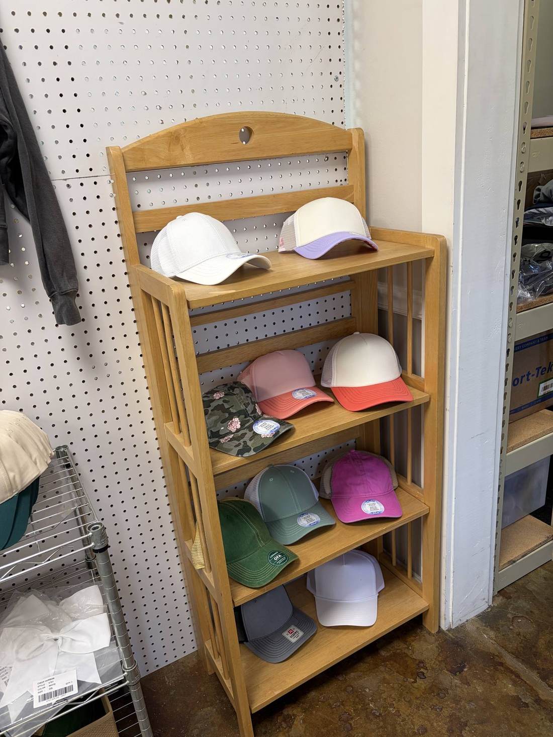 Rack of blank caps ready for embroidery